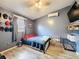 This bedroom features modern flooring, AC unit, TV and many decorative hats at 2214 Elise Marie Dr, Seffner, FL 33584