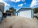 Side view of the garage with a fenced yard and screened in patio connected to the home at 2214 Elise Marie Dr, Seffner, FL 33584