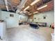 Spacious garage with seating area, overhead lighting and storage space at 2214 Elise Marie Dr, Seffner, FL 33584