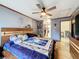 Cozy main bedroom with ceiling fan, hardwood floors, and ample closet space at 2214 Elise Marie Dr, Seffner, FL 33584
