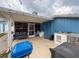 Outdoor patio has grill, built-in stone bar and screened-in porch at 2214 Elise Marie Dr, Seffner, FL 33584