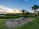 Community amenities feature a seating area and gorgeous waterfront view at sunset at 2424 Placida Rd # D102, Englewood, FL 34224