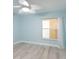Bright bedroom with new wood flooring, large window and ensuite bath at 2424 Placida Rd # D102, Englewood, FL 34224