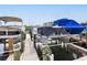 Community boat dock with multiple boat slips, offering convenient access to the water for residents at 2424 Placida Rd # D102, Englewood, FL 34224