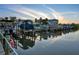 Picturesque boat slip showcasing multiple boats, clear water reflections, and a tranquil waterfront atmosphere at 2424 Placida Rd # D102, Englewood, FL 34224