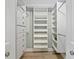 Organized walk-in closet with built in shelving and drawers at 2424 Placida Rd # D102, Englewood, FL 34224
