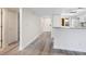 Inviting entryway with modern flooring and a view of the kitchen at 2424 Placida Rd # D102, Englewood, FL 34224