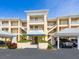 Well-maintained condo building with covered parking and inviting entrance at 2424 Placida Rd # D102, Englewood, FL 34224