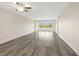 Bright, spacious living room with hardwood floors and large windows showcasing a pleasant view at 2424 Placida Rd # D102, Englewood, FL 34224
