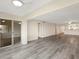 Open-concept living room featuring light wood floors, neutral walls, and ample space at 2424 Placida Rd # D102, Englewood, FL 34224