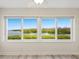 Waterfront views through a set of large windows bring in natural light and showcase water views at 2424 Placida Rd # D102, Englewood, FL 34224