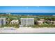 Oceanfront condos located steps from the beach, and golf courses in the background at 2425 Gulf Of Mexico Dr # 14B, Longboat Key, FL 34228