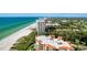 Condo with beach access, located on the beach, showcasing nearby buildings with stunning ocean views at 2425 Gulf Of Mexico Dr # 14B, Longboat Key, FL 34228