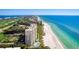 Beautiful condo building located directly on a white sand beach with clear turquoise waters and amenities at 2425 Gulf Of Mexico Dr # 14B, Longboat Key, FL 34228