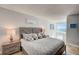 Bright bedroom with beach view from large window at 2425 Gulf Of Mexico Dr # 14B, Longboat Key, FL 34228