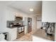 Kitchen with granite countertops, stainless steel appliances, and white cabinetry at 2425 Gulf Of Mexico Dr # 14B, Longboat Key, FL 34228