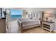Brightly lit primary bedroom with panoramic views of the ocean at 2425 Gulf Of Mexico Dr # 14B, Longboat Key, FL 34228