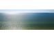 Expansive ocean view featuring clear blue water meeting the horizon under a bright, cloudless sky at 2425 Gulf Of Mexico Dr # 14B, Longboat Key, FL 34228