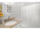Bathroom featuring granite countertops, updated vanity, and shower/tub combo at 2524 Tuttle Way, Sarasota, FL 34239