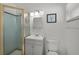 Bathroom with glass enclosed shower, modern vanity and updated fixtures at 2524 Tuttle Way, Sarasota, FL 34239