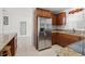 The kitchen features stainless steel appliances, and granite countertops at 2524 Tuttle Way, Sarasota, FL 34239