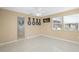 Sitting area with tile flooring, window, and decor vases on display at 2524 Tuttle Way, Sarasota, FL 34239