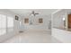 Bright living room with tile flooring, ceiling fan, and neutral paint at 2524 Tuttle Way, Sarasota, FL 34239