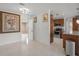 Open-concept living area with tile flooring, and direct views into the kitchen at 2524 Tuttle Way, Sarasota, FL 34239