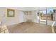 Enclosed patio with brick floors, a ceiling fan, and outdoor access at 2524 Tuttle Way, Sarasota, FL 34239