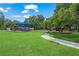 Community playground featuring colorful play structures, slides, and shaded seating areas for families to enjoy outdoors at 2524 Tuttle Way, Sarasota, FL 34239