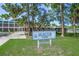 Arlington Park sign with the park building and trees in the background at 2524 Tuttle Way, Sarasota, FL 34239