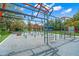 Well-equipped outdoor fitness area with various exercise stations and soft ground, ideal for active community residents at 2524 Tuttle Way, Sarasota, FL 34239