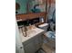 Cozy bathroom featuring sink with storage and toilet, plus tiled walls, and marine-themed decor at 2787 Jay Pl, Sarasota, FL 34235