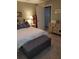 The bedroom displays an accent bench and a classic chest of drawers with views to the doorway at 2787 Jay Pl, Sarasota, FL 34235