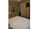 The bedroom is adorned with a full mirror and coordinating storage furniture at 2787 Jay Pl, Sarasota, FL 34235