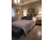 Bedroom featuring neutral walls and tile floor, adorned with decorative lighting and serene decor at 2787 Jay Pl, Sarasota, FL 34235