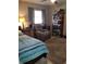 Comfortable bedroom featuring a leather recliner, bookcase and decorative rug at 2787 Jay Pl, Sarasota, FL 34235