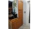 Kitchen cabinetry detail with dark countertop and stainless steel hardware plus modern appliances at 2787 Jay Pl, Sarasota, FL 34235