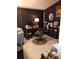Cozy office space with a dark desk, comfortable chair, and ample shelving, perfect for a productive work environment at 2787 Jay Pl, Sarasota, FL 34235