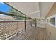 The property showcases a screened back porch with wooden flooring and ample natural light at 2820 Greenbriar St, Sarasota, FL 34237