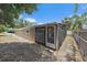 Backyard with a screened-in porch, offering a comfortable outdoor space at 2820 Greenbriar St, Sarasota, FL 34237