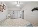 Cozy bedroom with a floral bedspread, closet and dresser, creating a comfortable retreat at 2820 Greenbriar St, Sarasota, FL 34237