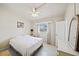 Bright bedroom featuring a ceiling fan, window, and a comfortable bed at 2820 Greenbriar St, Sarasota, FL 34237
