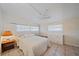 Bright bedroom with tile floor, large windows, and a quaint side table lamp at 2820 Greenbriar St, Sarasota, FL 34237