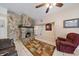 Comfortable living room with a stone fireplace and neutral tile floors at 2820 Greenbriar St, Sarasota, FL 34237