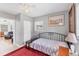Comfortable bedroom with carpet floors and decorative artwork and accents at 304 34Th W St, Bradenton, FL 34205
