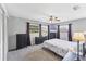 Cozy bedroom with carpet floors, fan, and views to the outside at 304 34Th W St, Bradenton, FL 34205