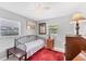 Cozy bedroom with vintage decor and neutral tones for a calming atmosphere at 304 34Th W St, Bradenton, FL 34205
