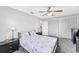 Neutral bedroom with carpet floors, ceiling fan, and double closets at 304 34Th W St, Bradenton, FL 34205