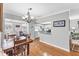 Charming dining area with wood floors, view to the kitchen and living room at 304 34Th W St, Bradenton, FL 34205